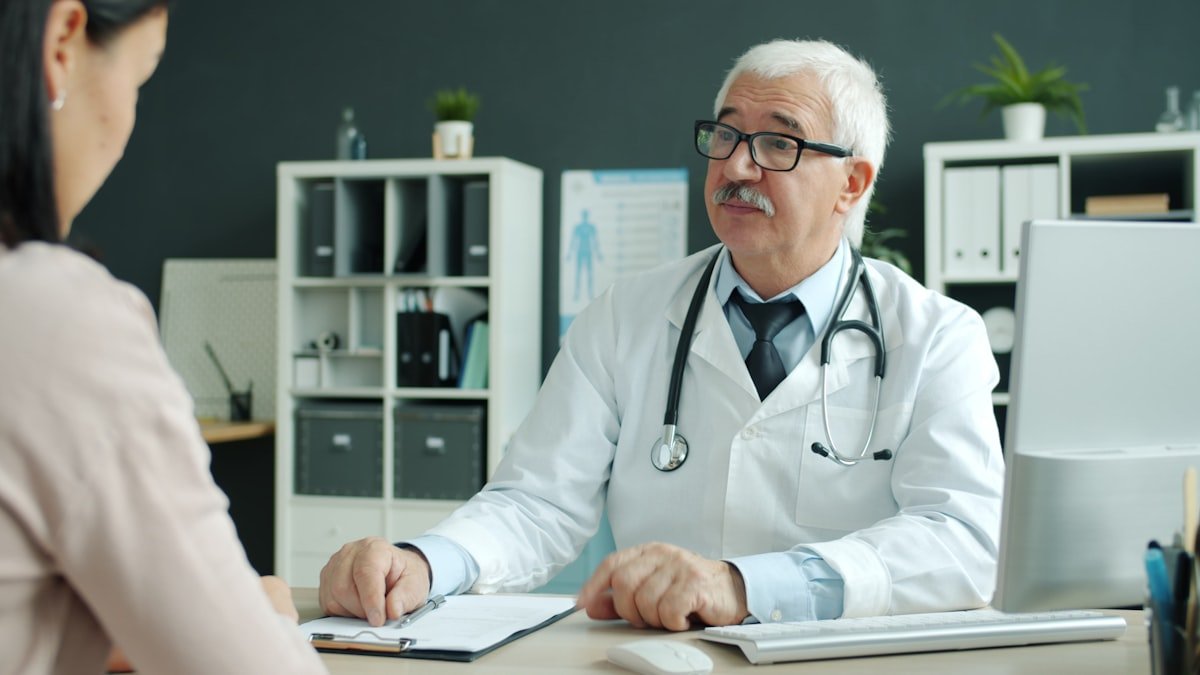 Doctor consulting with patient